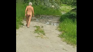 Naked walk on dirt road