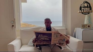 A muscular businessman jerks off in his beachfront villa