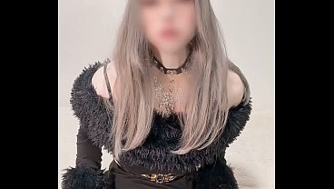 Belle, a femboy dressed as a girl in a black dress