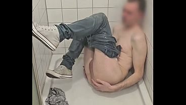 Playing in shower fully clothed with jeans and sneakers
