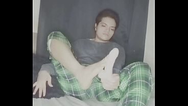 Boy playing and licking his toe