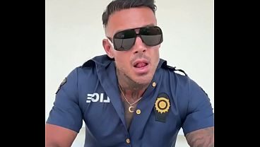 A man in police officer cosplay jerks off