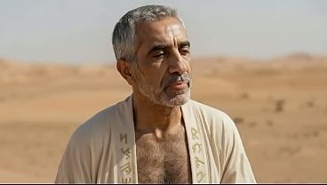 Ali, the old immortal mage gets his cock sucked in a desert by mature hairy man - AI Generated