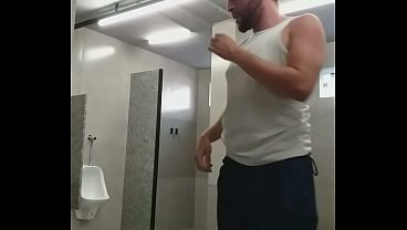 I almost got caught exposing myself in the gym bathroom, and the guys almost caught me.