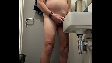 Pissing in a sink in public toilet