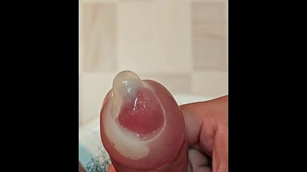 Cum again inside condom filled with semen