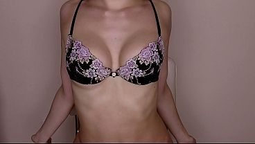 Sultry brunette seductively tries on her new lingerie