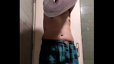 Iranian boy undressing with his face visible
