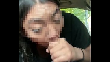 Asian giving head to BBC while driving