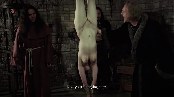 Mooin Witch – The exhausted milkmaid is pulled upside down to the ceiling with weights at her wrists  to be tormented and interrogated further and to see milk flowing (preview)