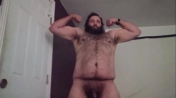 Hairy man flexing for the ladies